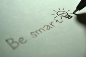 The words "be smart" with an illustration of a light bulb.